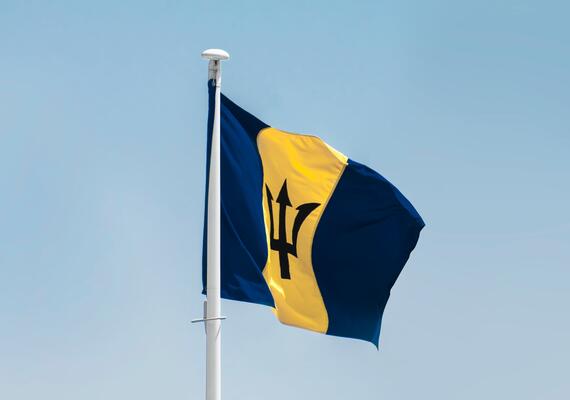 Barbados flag waving in the sky